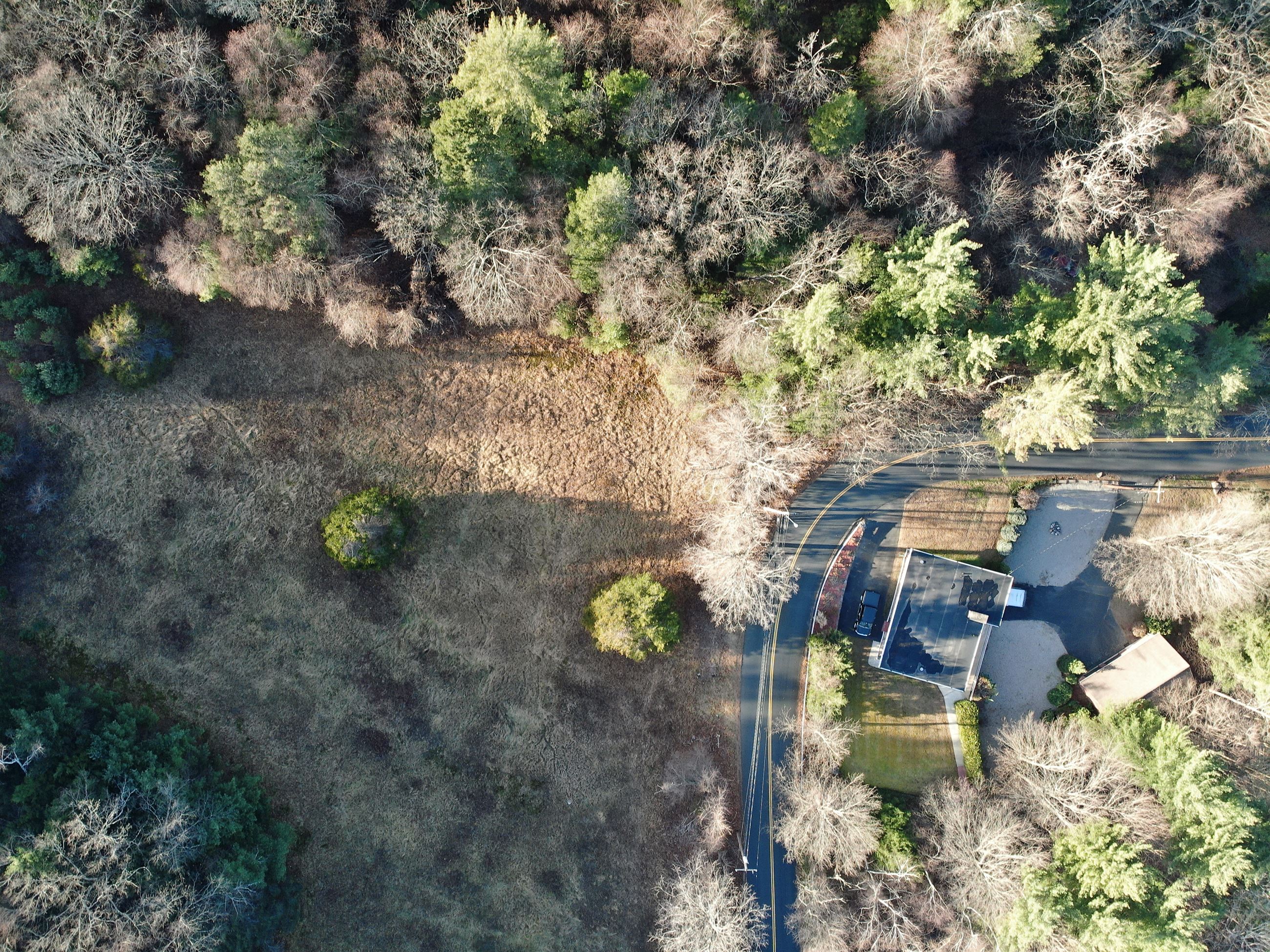 The bend at Northwest Road and a portion of the field at Pitoniak Fields Conservation Area.