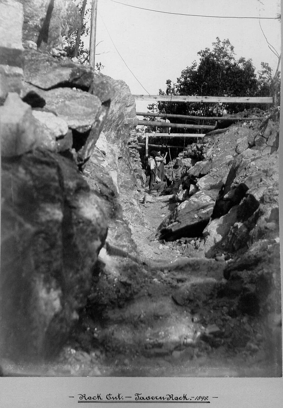 Men cutting large rock