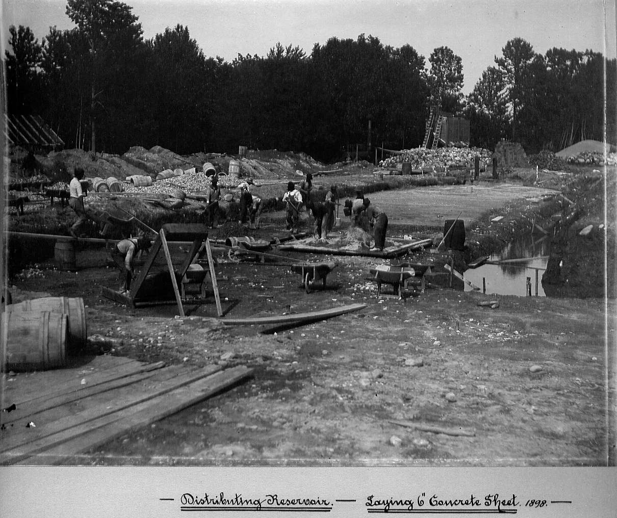 Men pouring and spreading concrete